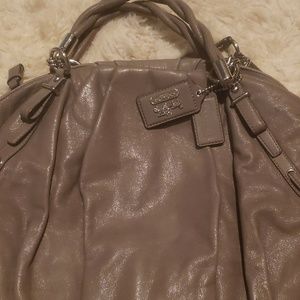 A gray coach purse